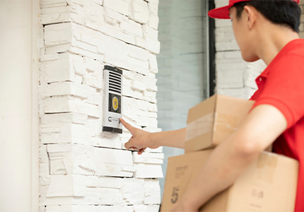 A courier boy is delivering packages door to door - Freight forwarder